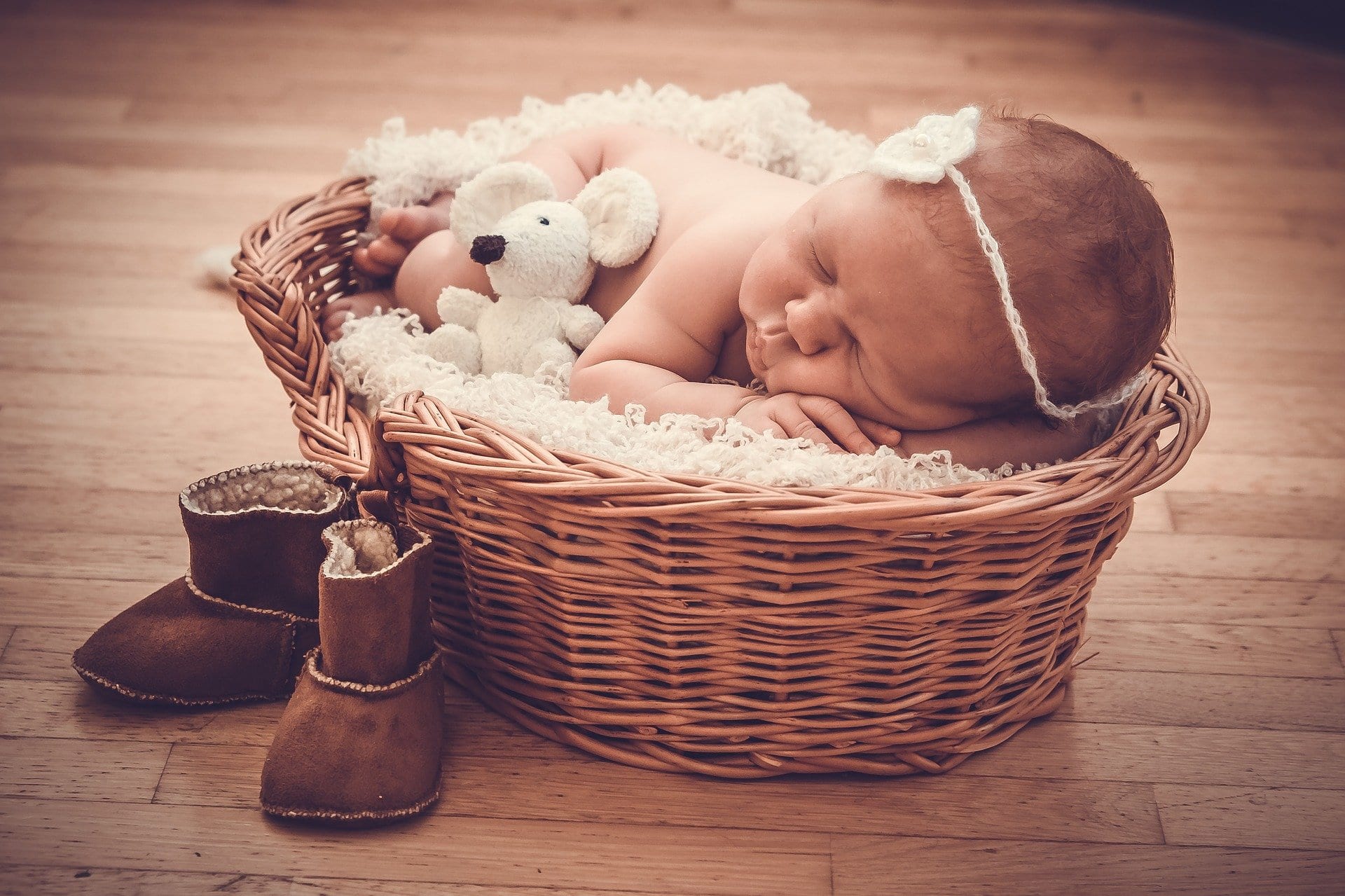 newborn in basket